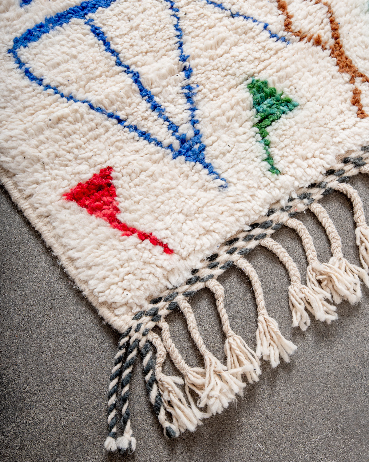 Modern, designer, handcrafted Berber rug from Morocco. Beniourain carpet with beautiful colours and patterns and fluffy wool texture.